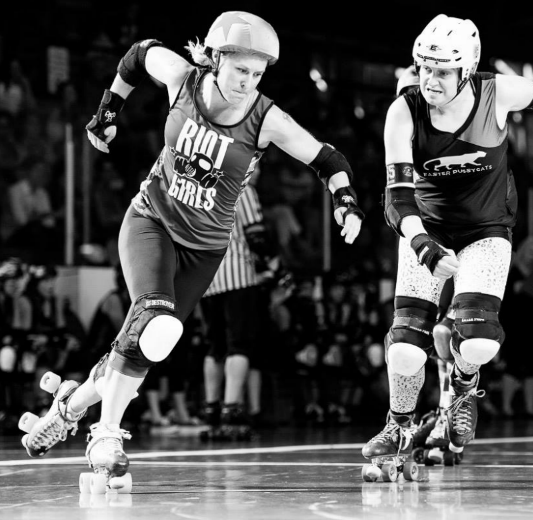 Booty Quake playing roller derby